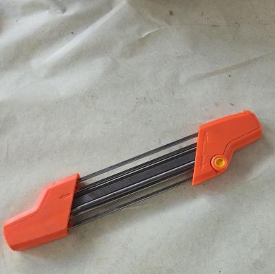 Aff�teur de cha�ne de tron�onneuse orange et noir, guide de lime, accessoire