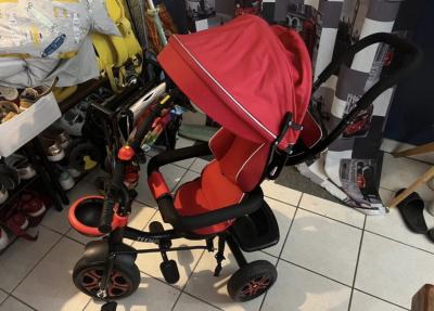 TEENO Tricycle poussette b�b� 3 roues rouge-noir pare soleil repose pieds