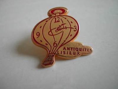 Pin's FOIRE   ANTIQUITES LISIEUX   Montre , horloge, montgolfi�re   Arthus B.