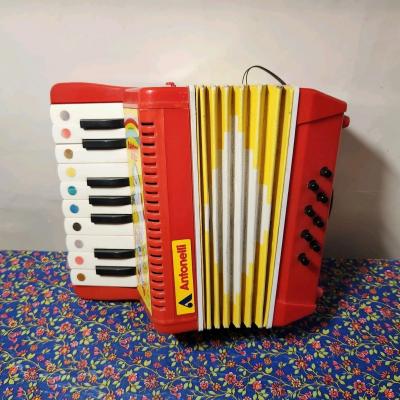 Antonelli accord�on Rainbow Brite rouge-jaune 13 touches 8 basses 1 registre