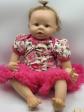 ZX   Poup�e B�b� R�aliste Vinyle Yeux Marron Robe Rose Tutu