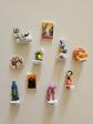 Lot de 10 f�ves (diverses collections : Ast�rix, Bugs Bunny, Kirikou, etc.)