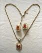 Parure collier et boucles d'oreilles en plaqu� or et cabochon rubis LERITZ