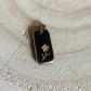 Pendentif fleur �mail noir et dor�