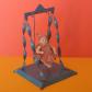 POUPEE MINIATURE CELLULOID ANCIENNE SUR SA BALANCOIRE EN TOLE G.D.B FRANCE 1930