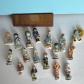 Lot de f�ves de collection costumes r�gionaux personnages figurines brillant