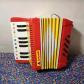 Antonelli accord�on Rainbow Brite rouge-jaune 13 touches 8 basses 1 registre